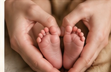 Parents cradling a newborn baby's little feet
